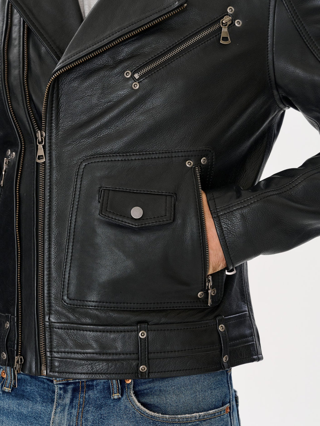 Black biker jacket pocket and hardware detail – DM Legend
