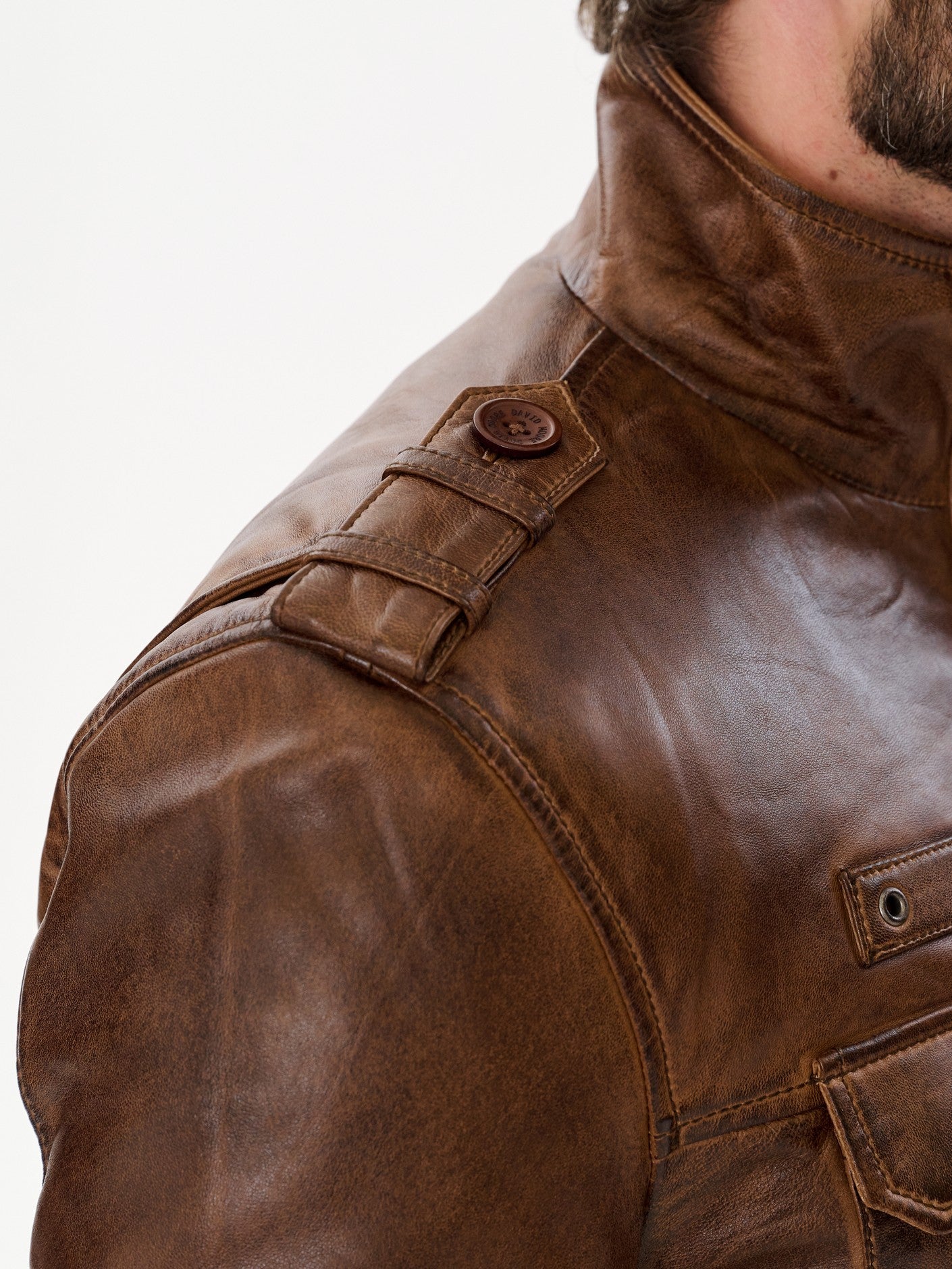 Brown military jacket shoulder strap detail – DM Legend