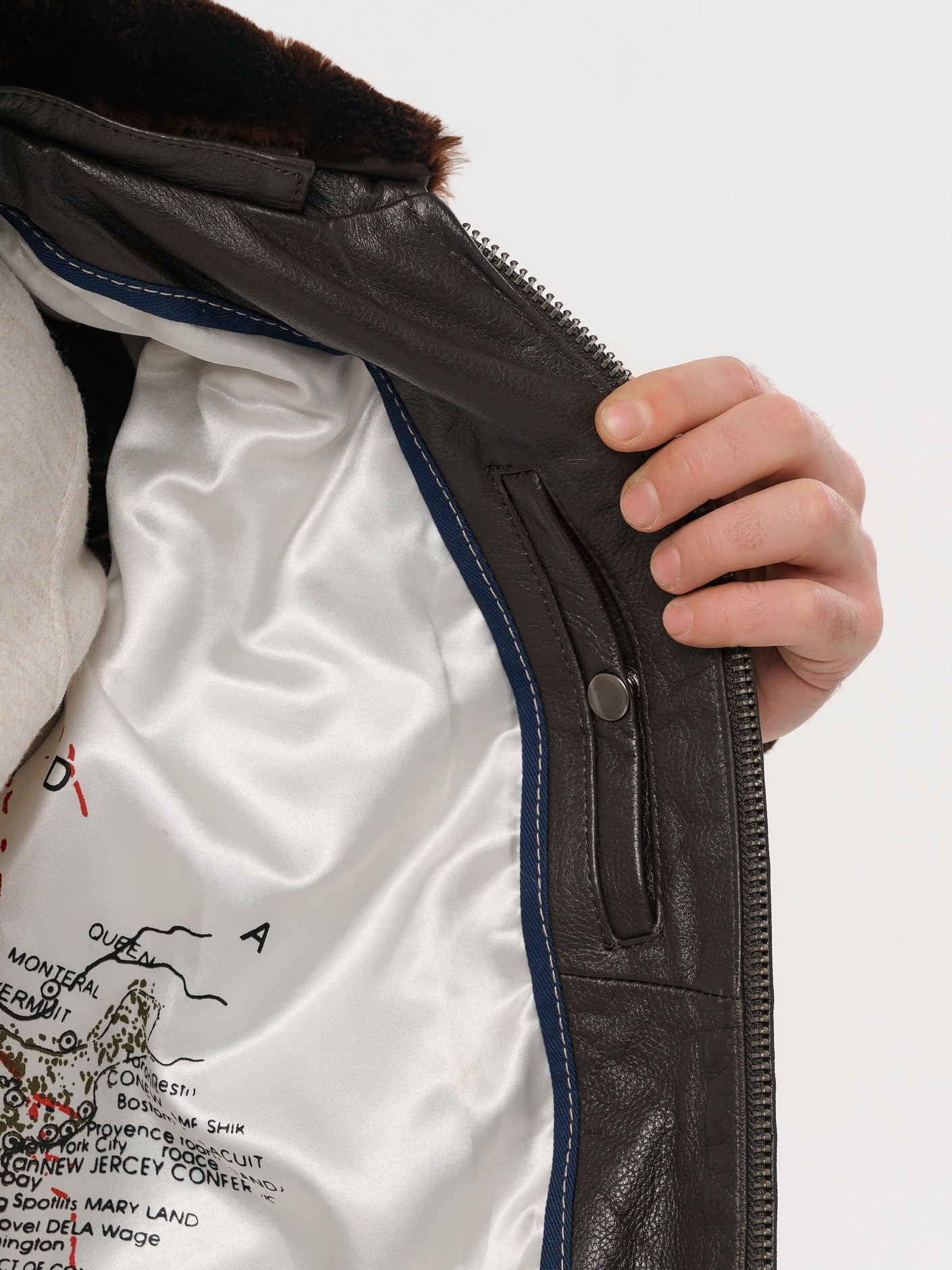 Dark brown bomber jacket interior lining and zip detail – DM Legend
