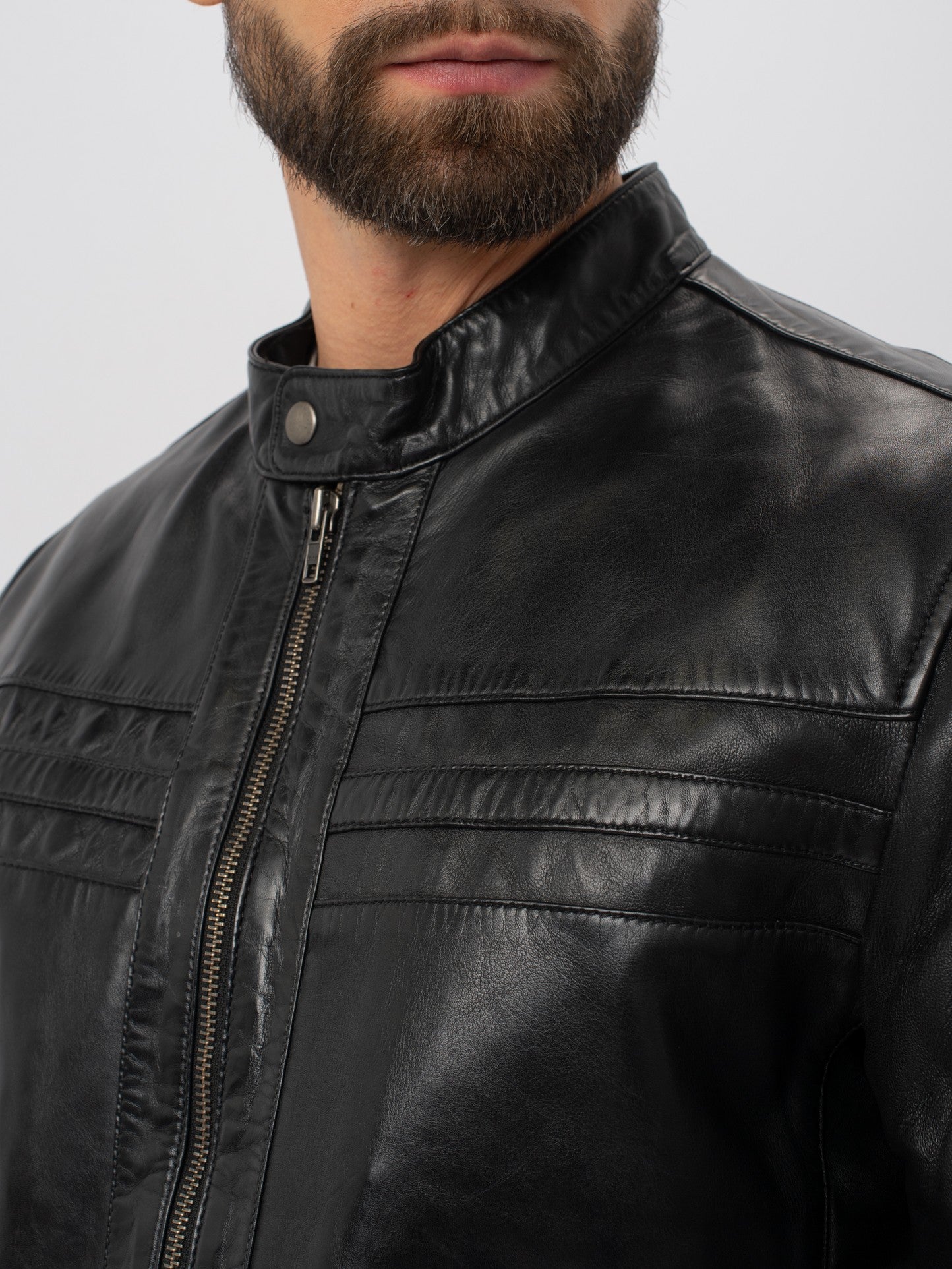 Black moto jacket collar and chest stitching detail – DM Legend
